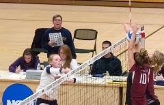 Calling out volleyball statistics during a George Fox contest.